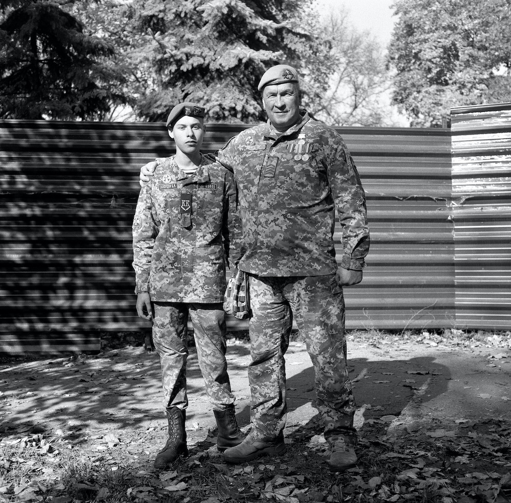 b&w scenes of two soldiers standing side by side